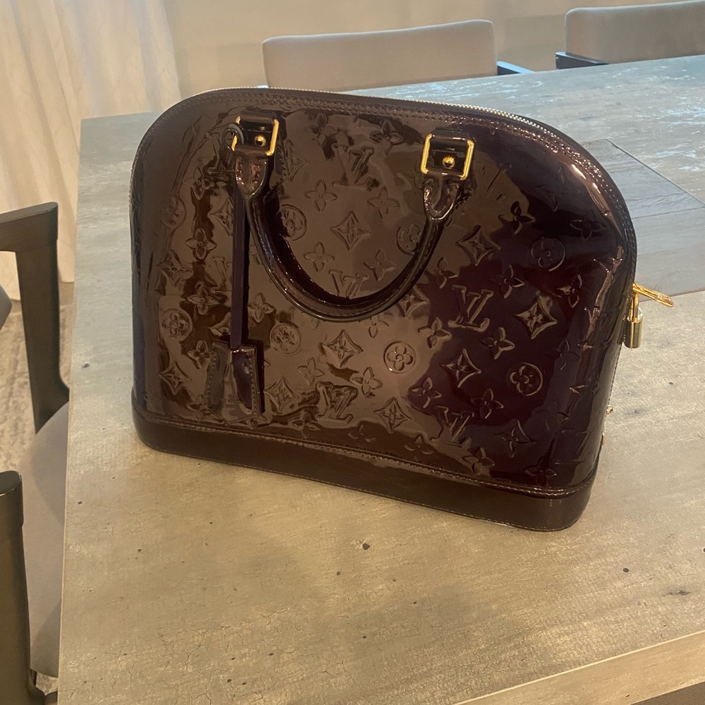 Louis Vuitton Wine Alma bag